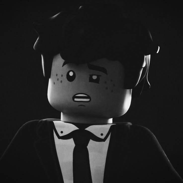 Black Profile Picture of Lego Character with Sad Expression