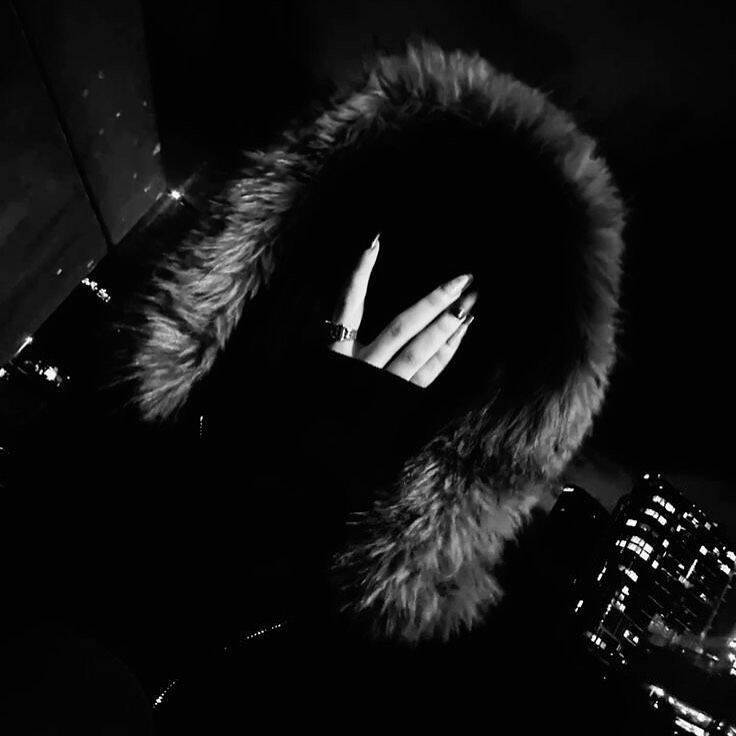 Black Profile Picture of Woman with Glove and Hood