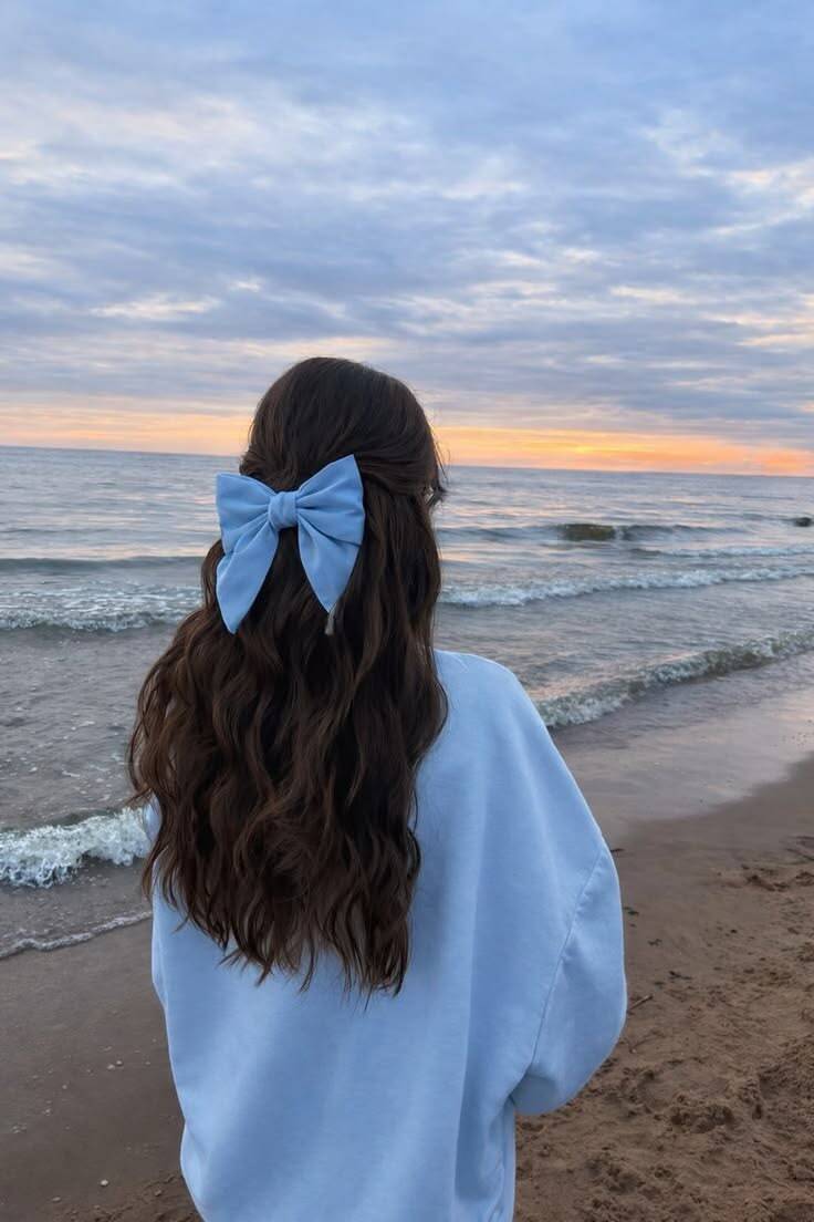 Aesthetic pfp Profile Picture with Blue Bow at the Beach at Sunset