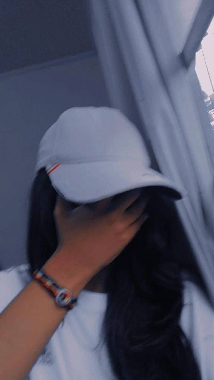 Girl​ pfp Profile Picture with Cap and Hand on Face