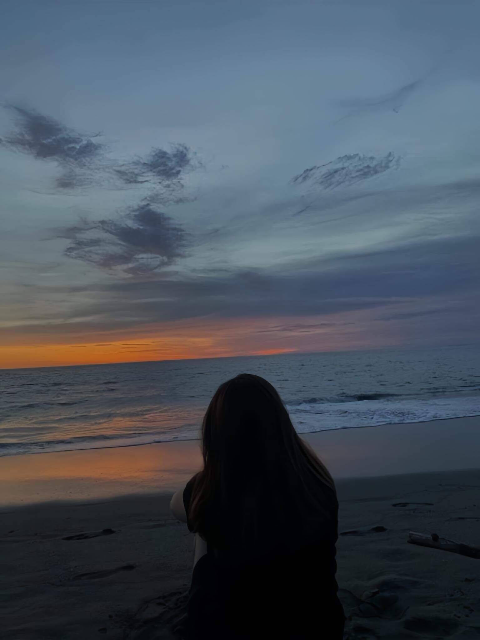 Sad pfp Profile Picture of Contemplative Woman on the Beach at Sunset