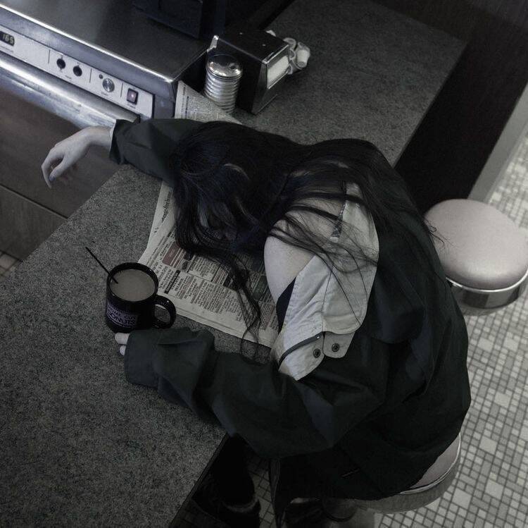 Sad pfp Profile Picture of Woman with Head Down in Café