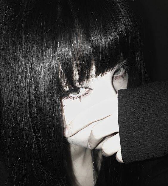 Black Profile of Woman with Long Hair and Striking Eyes pfp Profile Picture