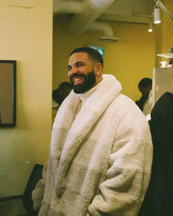 Drake pfp Profile Picture Smiling in Cozy White Coat